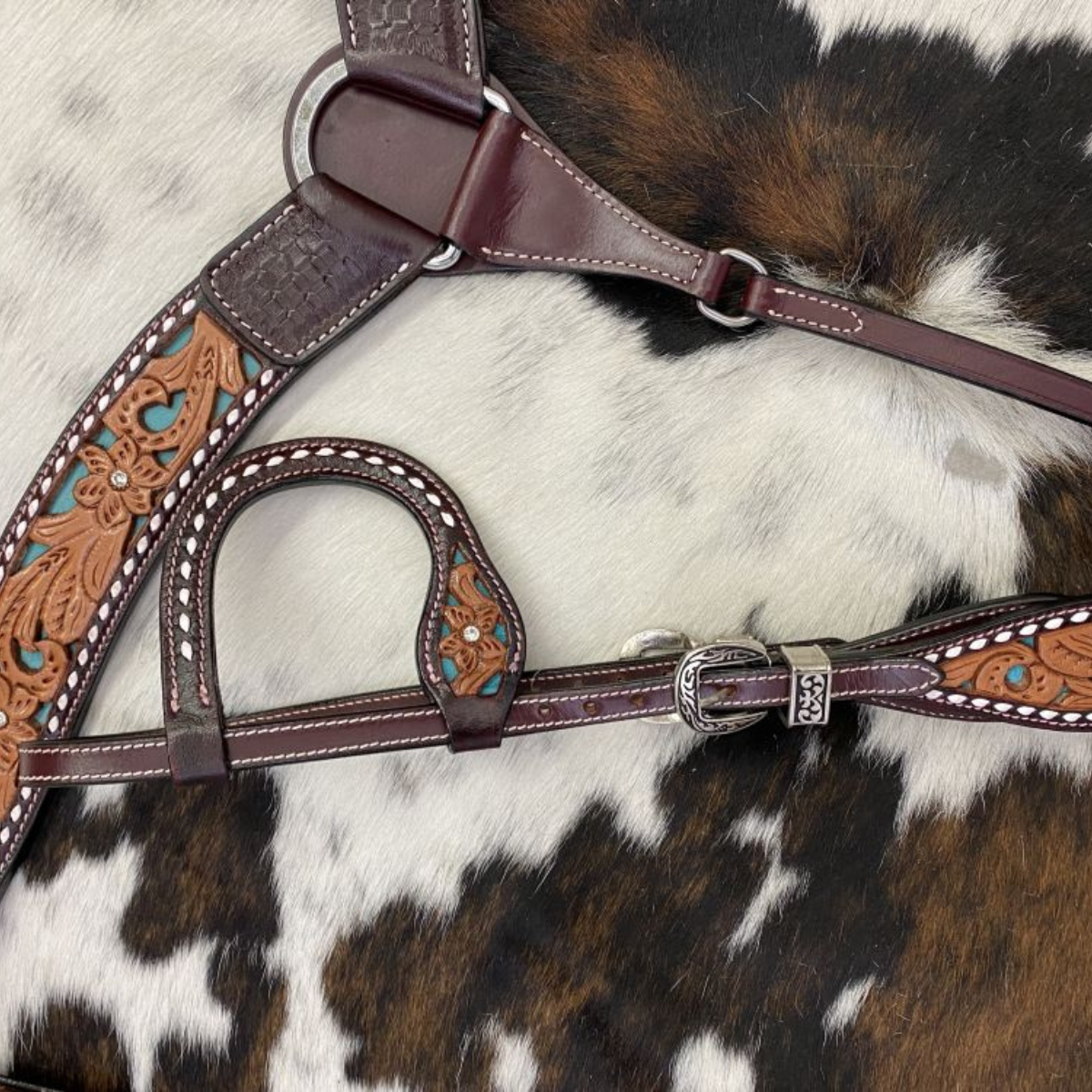 Showman ® Floral tooled design one ear bridle and breast collar set with buck stitching and teal underlay. - Double T Saddles